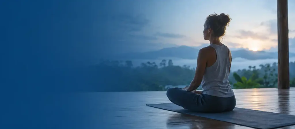 Yoga Teacher Training Mindset Guide How to Prepare for Yoga Teacher Training - Best Guide 2026 Yoga student meditating in a quiet natural setting, representing the right Yoga Teacher Training Mindset before joining a yoga TTC.