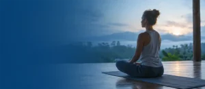 Yoga Teacher Training Mindset Guide Home Yoga student meditating in a quiet natural setting, representing the right Yoga Teacher Training Mindset before joining a yoga TTC.