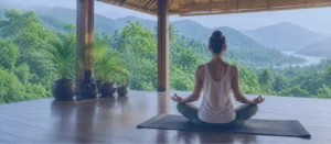 How to Choose a Yoga Retreat Home How to Choose a Yoga Retreat: Woman meditating in an open-air yoga retreat overlooking lush mountains, illustrating how to choose a yoga retreat based on environment, atmosphere, and location.