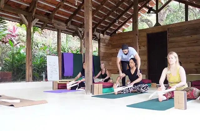 Sukhvinder Singh Chaitanya assisting a student during Yin Yoga TTC in India