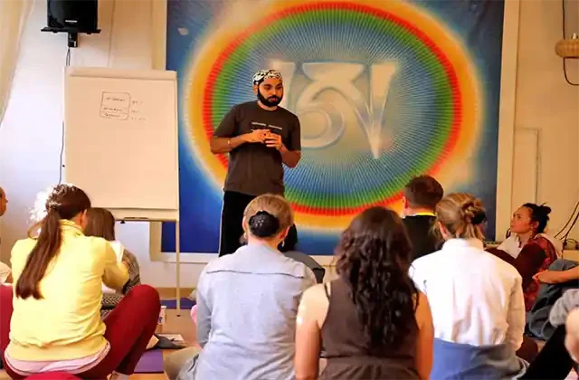 Sukhvinder Singh Chaitanya explaining yoga philosophy in yoga teacher training in Dharamshala