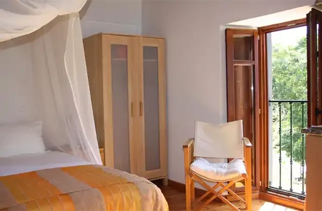 Triple sharing room for students at a yoga retreat in Portugal